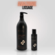 Deux flacons noirs d'Amazonie Thérapie, un grand et un petit, sur fond blanc – un produit de coiffure professionnel pas cher offrant un excellent rapport qualité/prix. Dahlia Color Professionnel
